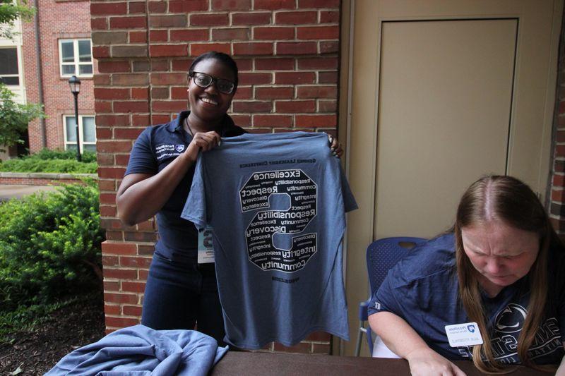 Penn State staff checks-in delegates to the Summer Leadership Conference