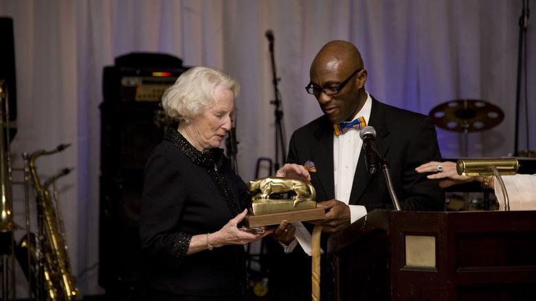 Dr. Achampong presenting an award for philanthropy to Carolyn Eberly-Blaney